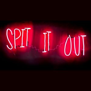 Spit it out pink neon lettering by Andy Doig ready to hang